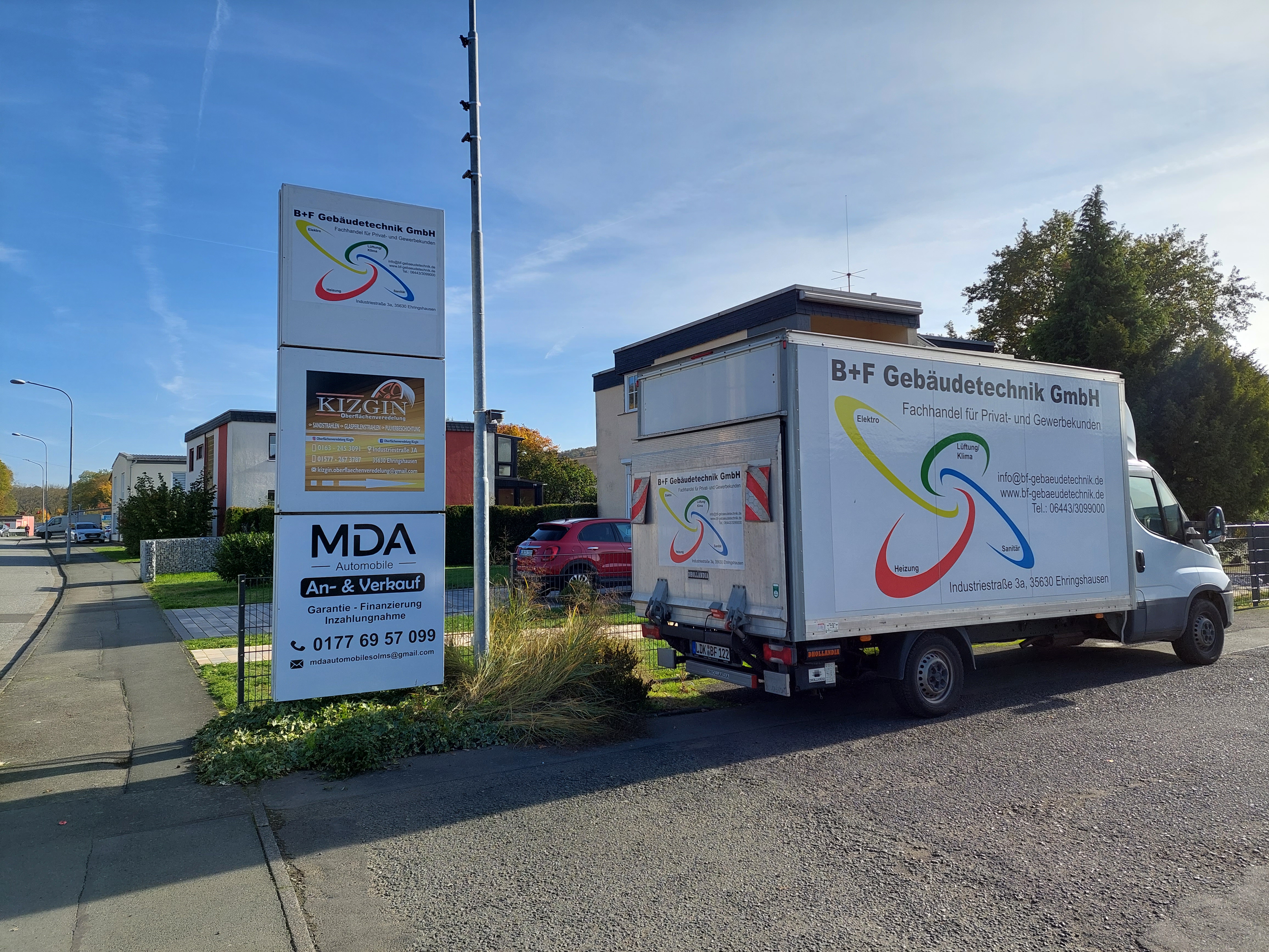Street view of B+F Gebäudetechnik at Industriestraße 3a in Ehringshausen, recognizable by the company sign and delivery truck